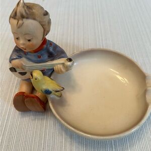 Goebel Porcelain Figurine Ashtray with Boy playing Banjo and bird perched.